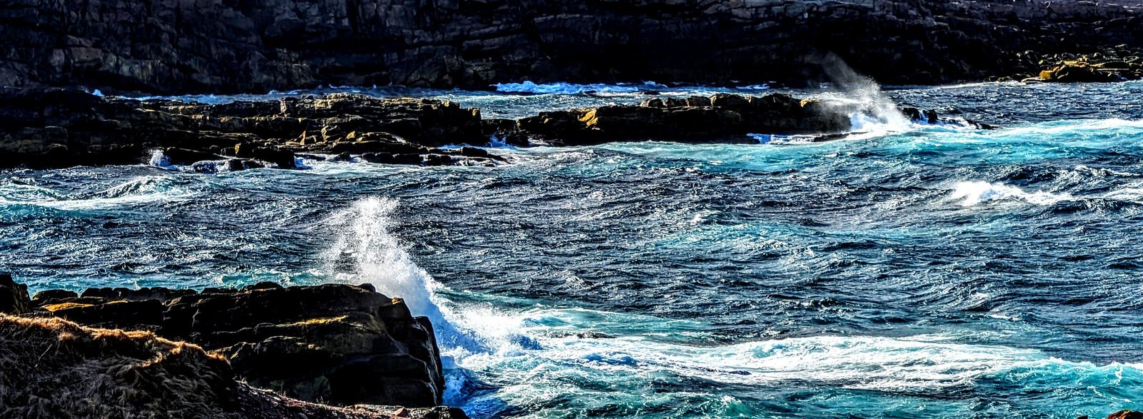 Atlantic waves moving through the rocky shoreline at Cape Spear